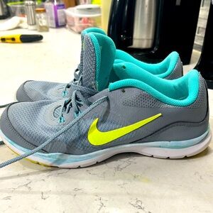 Gray/yellow Nike tennis shoes